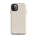 A beige smartphone case with a subtle vertical stripe pattern is shown. Crafted from impact-resistant polycarbonate, it fits a phone with a triple camera setup and flash. The durable dual-layer case includes a TPU inner liner for extra protection. "Statement Cases" is printed on the lower back of the *Noble Pinstripe for iPhone*.