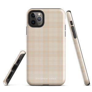 A smartphone with a plaid design case is displayed. The durable phone case features a beige and light brown checked pattern. The phone's camera lenses are visible at the top left corner. With dual-layer protection, the bottom of the impact-resistant polycarbonate Sophisticated Plaid for iPhone case reads "Statement Cases" in white.