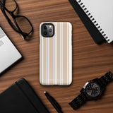 A beige and white striped, impact-resistant phone case for a smartphone. The Estate Stripe for iPhone features vertical stripes and dual-layer protection, designed to fit a phone with multiple camera lenses. The brand name "Statement Cases" is subtly printed at the bottom.