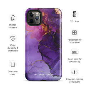 A Statement Cases Golden Orchid Marble for iPhone with a case featuring an abstract design of swirling purple, pink, and gold hues over a white background. The marbled patterns with metallic accents provide dual-layer protection and are impact-resistant. The top of the case has cutouts for the phone's camera lenses and is induction charging compatible.