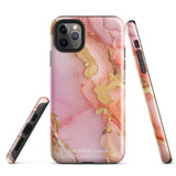 The Gold Blush Marble for iPhone showcases a glossy, marble-patterned case in shades of pink and gold. The decorative design features swirling patterns, seamlessly blending the colors. Crafted with impact-resistant polycarbonate for superior phone protection, "Statement Cases" is written in white at the bottom.