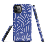 An iPhone encased in the "Mariposa Azul" by Statement Cases, featuring a blue design with an abstract white leaf pattern. The case combines curved and pointed shapes and provides dual-layer protection with TPU lining and impact-resistant polycarbonate. Camera lenses and other top elements remain unobstructed, and "Statement Cases" is inscribed at the bottom.