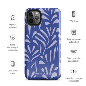 An iPhone encased in the "Mariposa Azul" by Statement Cases, featuring a blue design with an abstract white leaf pattern. The case combines curved and pointed shapes and provides dual-layer protection with TPU lining and impact-resistant polycarbonate. Camera lenses and other top elements remain unobstructed, and "Statement Cases" is inscribed at the bottom.