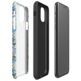 The Blue Mirage for iPhone by Statement Cases features a dual-layered, impact-resistant polycarbonate exterior with a TPU inner liner. Inspired by traditional Portuguese tiles, the blue and yellow patterned case boasts an intricate design of floral and geometric motifs. With its elegant and colorful appearance, the phone's camera is visible at the top left of the case.