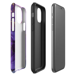 A Statement Cases Golden Orchid Marble for iPhone with a case featuring an abstract design of swirling purple, pink, and gold hues over a white background. The marbled patterns with metallic accents provide dual-layer protection and are impact-resistant. The top of the case has cutouts for the phone's camera lenses and is induction charging compatible.