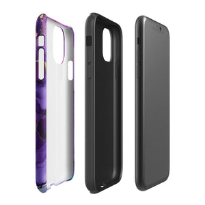 A Statement Cases Golden Orchid Marble for iPhone with a case featuring an abstract design of swirling purple, pink, and gold hues over a white background. The marbled patterns with metallic accents provide dual-layer protection and are impact-resistant. The top of the case has cutouts for the phone's camera lenses and is induction charging compatible.