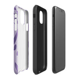 The Luna Morada for iPhone by Statement Cases is a durable phone case with a purple protective exterior featuring abstract dark purple and lavender patterns. The design includes geometric shapes and curves, giving it a modern artistic look. Made from impact-resistant polycarbonate, the lower part of the case prominently displays "STATEMENT CASES.