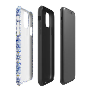 The Lisboa Azul for iPhone by Statement Cases is a smartphone adorned with a dual-layer protection phone case, featuring an intricate blue and white tile pattern. The design showcases various geometric and floral motifs, forming a visually appealing mosaic effect. The impact-resistant camera lenses and flash are prominently visible at the top left.