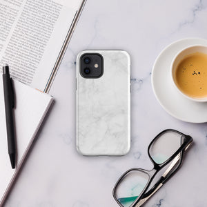 A protective iPhone case with a white marble-patterned design featuring three camera lenses and a flash. The marble pattern on this Marble Dreams for iPhone 15 Pro Max case is subtle, with light gray veining. The brand "Statement Cases" is subtly engraved at the bottom of the case.