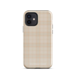 A smartphone with a plaid design case is displayed. The durable phone case features a beige and light brown checked pattern. The phone's camera lenses are visible at the top left corner. With dual-layer protection, the bottom of the impact-resistant polycarbonate Sophisticated Plaid for iPhone case reads "Statement Cases" in white.