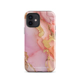 The Gold Blush Marble for iPhone showcases a glossy, marble-patterned case in shades of pink and gold. The decorative design features swirling patterns, seamlessly blending the colors. Crafted with impact-resistant polycarbonate for superior phone protection, "Statement Cases" is written in white at the bottom.