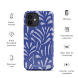 An iPhone encased in the "Mariposa Azul" by Statement Cases, featuring a blue design with an abstract white leaf pattern. The case combines curved and pointed shapes and provides dual-layer protection with TPU lining and impact-resistant polycarbonate. Camera lenses and other top elements remain unobstructed, and "Statement Cases" is inscribed at the bottom.