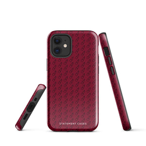 A protective iPhone case with a maroon background and a repeating pattern of small eyeglasses. Designed for the iPhone 15 Pro Max, the camera and buttons of the phone are visible. The bottom of the case features the text "Rockstar Red for iPhone" in white from Statement Cases.