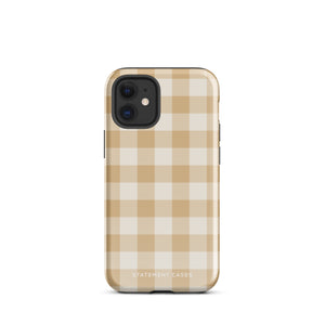 A Gingham Grace for iPhone by Statement Cases is covered with a protective case featuring a beige and white checkered pattern. The case's design includes a matte finish, dual-layer protection with an impact-resistant polycarbonate exterior and TPU lining, and the text "Statement Cases" printed near the bottom. The phone's cameras and buttons are visible.