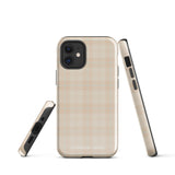 A smartphone with a plaid design case is displayed. The durable phone case features a beige and light brown checked pattern. The phone's camera lenses are visible at the top left corner. With dual-layer protection, the bottom of the impact-resistant polycarbonate Sophisticated Plaid for iPhone case reads "Statement Cases" in white.