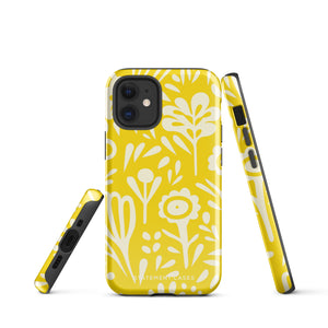 The Sol Dorado for iPhone by Statement Cases is a smartphone with a yellow case featuring a white, abstract floral and plant pattern. The camera lenses are prominent in the top left corner of the device. With dual-layer protection and impact-resistant TPU lining, "Statement Cases" is printed at the bottom of the case.