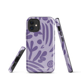 The Luna Morada for iPhone by Statement Cases is a durable phone case with a purple protective exterior featuring abstract dark purple and lavender patterns. The design includes geometric shapes and curves, giving it a modern artistic look. Made from impact-resistant polycarbonate, the lower part of the case prominently displays "STATEMENT CASES.