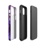 A Statement Cases Golden Orchid Marble for iPhone with a case featuring an abstract design of swirling purple, pink, and gold hues over a white background. The marbled patterns with metallic accents provide dual-layer protection and are impact-resistant. The top of the case has cutouts for the phone's camera lenses and is induction charging compatible.