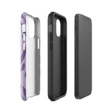 The Luna Morada for iPhone by Statement Cases is a durable phone case with a purple protective exterior featuring abstract dark purple and lavender patterns. The design includes geometric shapes and curves, giving it a modern artistic look. Made from impact-resistant polycarbonate, the lower part of the case prominently displays "STATEMENT CASES.