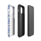 The Lisboa Azul for iPhone by Statement Cases is a smartphone adorned with a dual-layer protection phone case, featuring an intricate blue and white tile pattern. The design showcases various geometric and floral motifs, forming a visually appealing mosaic effect. The impact-resistant camera lenses and flash are prominently visible at the top left.