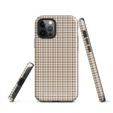 A smartphone with a brown and beige houndstooth-patterned case is shown from the back. The impact-resistant, dual-layered Classic Houndstooth for iPhone by Statement Cases protects the phone's body and leaves openings for the camera lenses and flash. The hues give the case a stylish and sophisticated appearance.