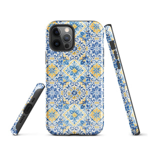 The Blue Mirage for iPhone by Statement Cases features a dual-layered, impact-resistant polycarbonate exterior with a TPU inner liner. Inspired by traditional Portuguese tiles, the blue and yellow patterned case boasts an intricate design of floral and geometric motifs. With its elegant and colorful appearance, the phone's camera is visible at the top left of the case.