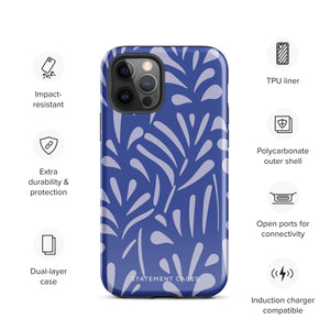 An iPhone encased in the "Mariposa Azul" by Statement Cases, featuring a blue design with an abstract white leaf pattern. The case combines curved and pointed shapes and provides dual-layer protection with TPU lining and impact-resistant polycarbonate. Camera lenses and other top elements remain unobstructed, and "Statement Cases" is inscribed at the bottom.