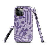 The Luna Morada for iPhone by Statement Cases is a durable phone case with a purple protective exterior featuring abstract dark purple and lavender patterns. The design includes geometric shapes and curves, giving it a modern artistic look. Made from impact-resistant polycarbonate, the lower part of the case prominently displays "STATEMENT CASES.