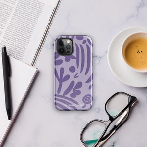 The Luna Morada for iPhone by Statement Cases is a durable phone case with a purple protective exterior featuring abstract dark purple and lavender patterns. The design includes geometric shapes and curves, giving it a modern artistic look. Made from impact-resistant polycarbonate, the lower part of the case prominently displays "STATEMENT CASES.