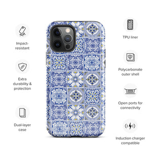 The Lisboa Azul for iPhone by Statement Cases is a smartphone adorned with a dual-layer protection phone case, featuring an intricate blue and white tile pattern. The design showcases various geometric and floral motifs, forming a visually appealing mosaic effect. The impact-resistant camera lenses and flash are prominently visible at the top left.