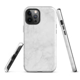 A protective iPhone case with a white marble-patterned design featuring three camera lenses and a flash. The marble pattern on this Marble Dreams for iPhone 15 Pro Max case is subtle, with light gray veining. The brand "Statement Cases" is subtly engraved at the bottom of the case.