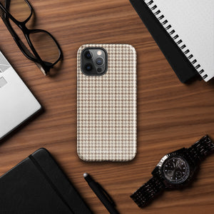 A smartphone with a brown and beige houndstooth-patterned case is shown from the back. The impact-resistant, dual-layered Classic Houndstooth for iPhone by Statement Cases protects the phone's body and leaves openings for the camera lenses and flash. The hues give the case a stylish and sophisticated appearance.