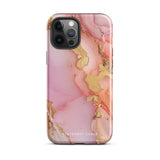 The Gold Blush Marble for iPhone showcases a glossy, marble-patterned case in shades of pink and gold. The decorative design features swirling patterns, seamlessly blending the colors. Crafted with impact-resistant polycarbonate for superior phone protection, "Statement Cases" is written in white at the bottom.