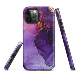 A Statement Cases Golden Orchid Marble for iPhone with a case featuring an abstract design of swirling purple, pink, and gold hues over a white background. The marbled patterns with metallic accents provide dual-layer protection and are impact-resistant. The top of the case has cutouts for the phone's camera lenses and is induction charging compatible.