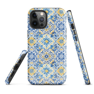 The Blue Mirage for iPhone by Statement Cases features a dual-layered, impact-resistant polycarbonate exterior with a TPU inner liner. Inspired by traditional Portuguese tiles, the blue and yellow patterned case boasts an intricate design of floral and geometric motifs. With its elegant and colorful appearance, the phone's camera is visible at the top left of the case.