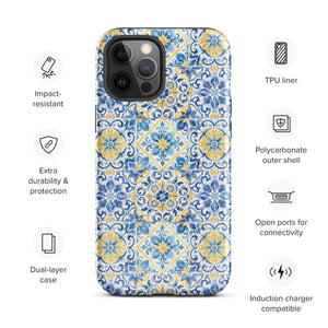 The Blue Mirage for iPhone by Statement Cases features a dual-layered, impact-resistant polycarbonate exterior with a TPU inner liner. Inspired by traditional Portuguese tiles, the blue and yellow patterned case boasts an intricate design of floral and geometric motifs. With its elegant and colorful appearance, the phone's camera is visible at the top left of the case.