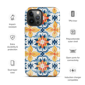 Statement Cases' Mediterranean Bloom for iPhone is showcased, featuring an intricate, colorful pattern. The design includes blue, yellow, and orange floral shapes in a symmetrical arrangement on a light blue background. This durable phone case provides dual-layer protection and is constructed from impact-resistant polycarbonate to safeguard your device.