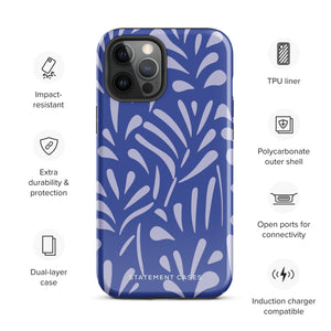 An iPhone encased in the "Mariposa Azul" by Statement Cases, featuring a blue design with an abstract white leaf pattern. The case combines curved and pointed shapes and provides dual-layer protection with TPU lining and impact-resistant polycarbonate. Camera lenses and other top elements remain unobstructed, and "Statement Cases" is inscribed at the bottom.