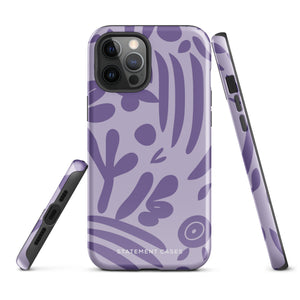 The Luna Morada for iPhone by Statement Cases is a durable phone case with a purple protective exterior featuring abstract dark purple and lavender patterns. The design includes geometric shapes and curves, giving it a modern artistic look. Made from impact-resistant polycarbonate, the lower part of the case prominently displays "STATEMENT CASES.