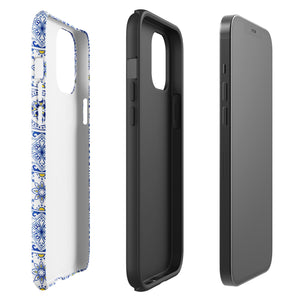 The Lisboa Azul for iPhone by Statement Cases is a smartphone adorned with a dual-layer protection phone case, featuring an intricate blue and white tile pattern. The design showcases various geometric and floral motifs, forming a visually appealing mosaic effect. The impact-resistant camera lenses and flash are prominently visible at the top left.