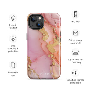 The Gold Blush Marble for iPhone showcases a glossy, marble-patterned case in shades of pink and gold. The decorative design features swirling patterns, seamlessly blending the colors. Crafted with impact-resistant polycarbonate for superior phone protection, "Statement Cases" is written in white at the bottom.