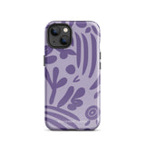 The Luna Morada for iPhone by Statement Cases is a durable phone case with a purple protective exterior featuring abstract dark purple and lavender patterns. The design includes geometric shapes and curves, giving it a modern artistic look. Made from impact-resistant polycarbonate, the lower part of the case prominently displays "STATEMENT CASES.