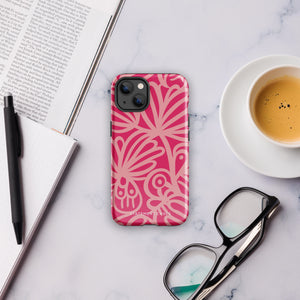 Introducing the Zafiro Rosa for iPhone by Statement Cases: a smartphone case featuring abstract floral and leaf patterns in various shades of pink. This dual-layer protection case combines an impact-resistant polycarbonate exterior with a TPU inner liner to ensure durability. The design showcases the brand name "Statement Cases" at the bottom, with precise cutouts revealing the phone’s camera lenses at the top left corner.