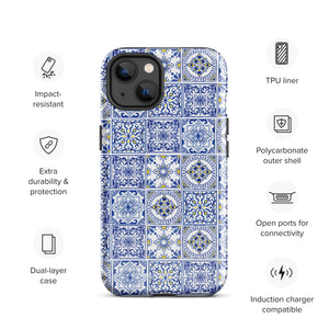 The Lisboa Azul for iPhone by Statement Cases is a smartphone adorned with a dual-layer protection phone case, featuring an intricate blue and white tile pattern. The design showcases various geometric and floral motifs, forming a visually appealing mosaic effect. The impact-resistant camera lenses and flash are prominently visible at the top left.