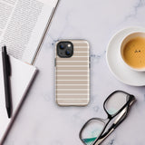 A durable dual-layered case in beige with horizontal white stripes is placed upright, showcasing the back of the phone with its camera lenses and flash. The brand name "Statement Cases" is printed at the bottom of the Au Naturale for iPhone case.