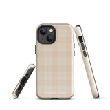 A smartphone with a plaid design case is displayed. The durable phone case features a beige and light brown checked pattern. The phone's camera lenses are visible at the top left corner. With dual-layer protection, the bottom of the impact-resistant polycarbonate Sophisticated Plaid for iPhone case reads "Statement Cases" in white.