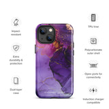 A Statement Cases Golden Orchid Marble for iPhone with a case featuring an abstract design of swirling purple, pink, and gold hues over a white background. The marbled patterns with metallic accents provide dual-layer protection and are impact-resistant. The top of the case has cutouts for the phone's camera lenses and is induction charging compatible.