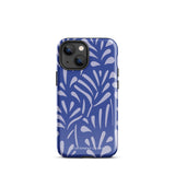 An iPhone encased in the "Mariposa Azul" by Statement Cases, featuring a blue design with an abstract white leaf pattern. The case combines curved and pointed shapes and provides dual-layer protection with TPU lining and impact-resistant polycarbonate. Camera lenses and other top elements remain unobstructed, and "Statement Cases" is inscribed at the bottom.