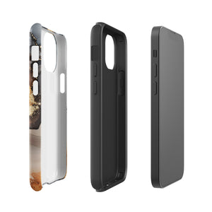 A smartphone with a sleek, marbled design case featuring swirls of gold, beige, and dark grey colors. The camera lenses on the back of the iPhone 15 Pro Max are clearly visible, and the protective Lunar & Gold Marble for iPhone case is branded with "Statement Cases" at the bottom.