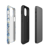 The Blue Mirage for iPhone by Statement Cases features a dual-layered, impact-resistant polycarbonate exterior with a TPU inner liner. Inspired by traditional Portuguese tiles, the blue and yellow patterned case boasts an intricate design of floral and geometric motifs. With its elegant and colorful appearance, the phone's camera is visible at the top left of the case.